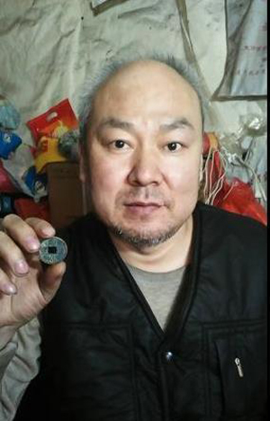 薛建華：一位殘疾人的錢幣收藏夢